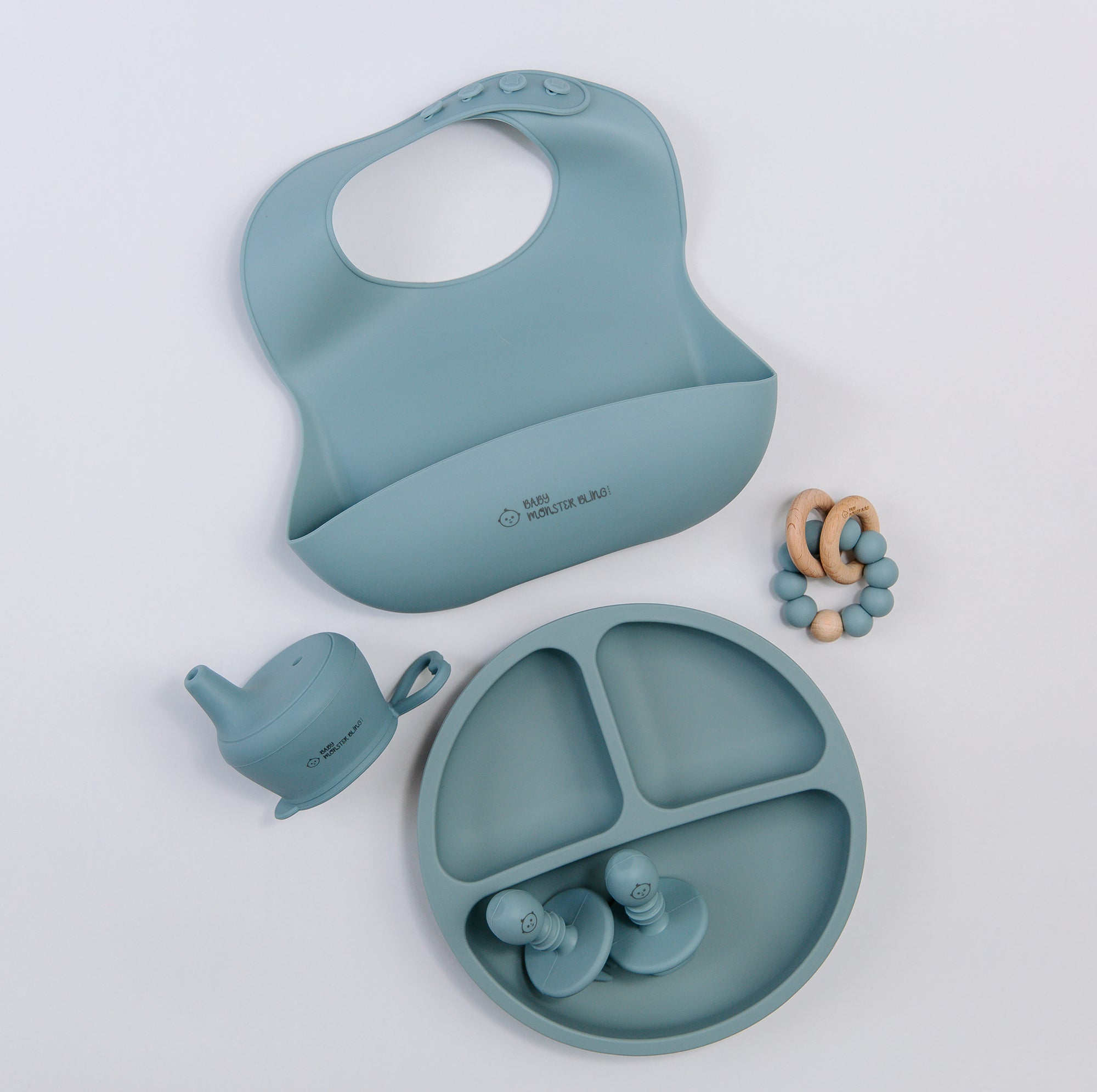 Meal set including bib, plate, utensils, silicone lids, teething rattle