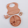 Meal set including bib, plate, utensils, silicone lids, teething rattle