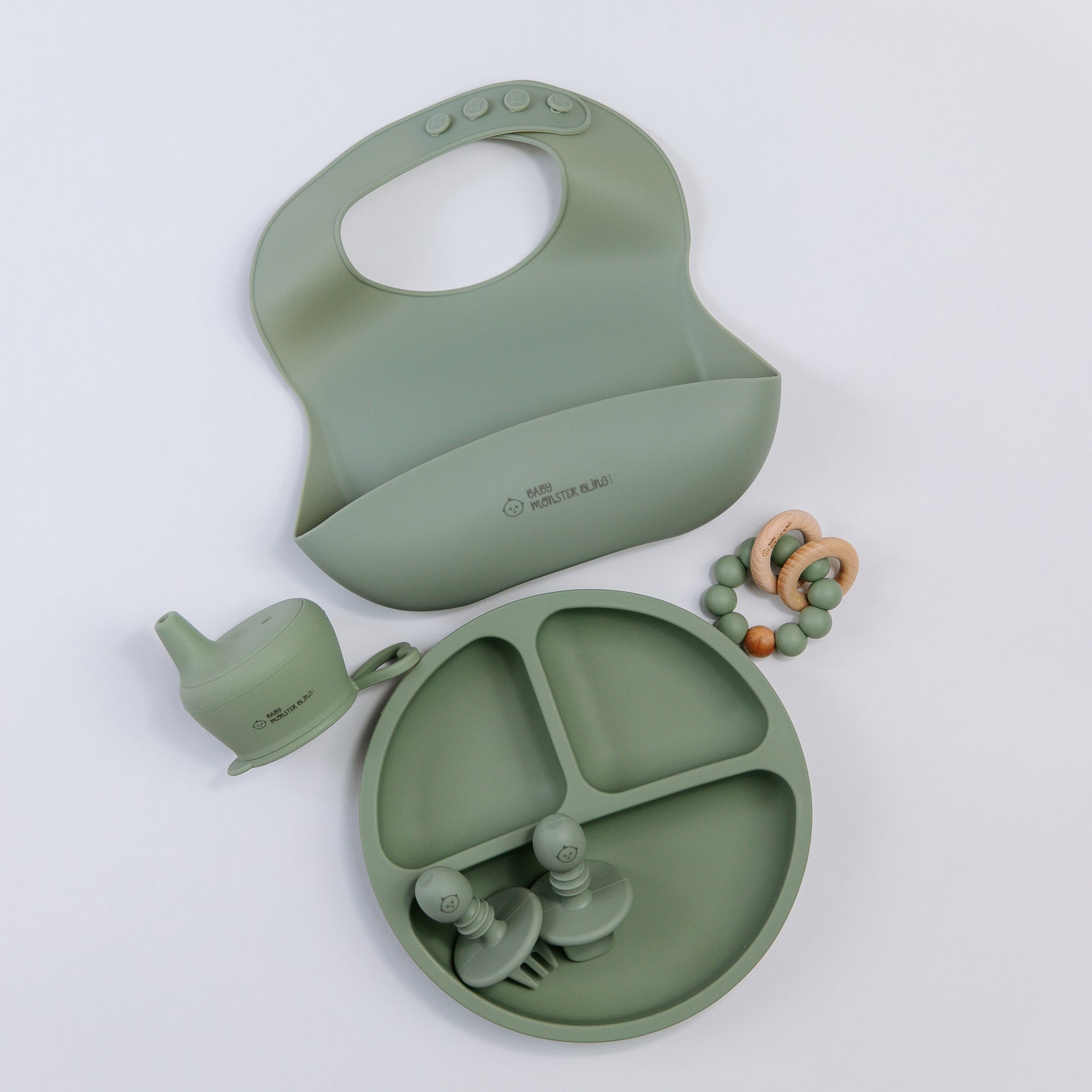 Meal set including bib, plate, utensils, silicone lids, teething rattle